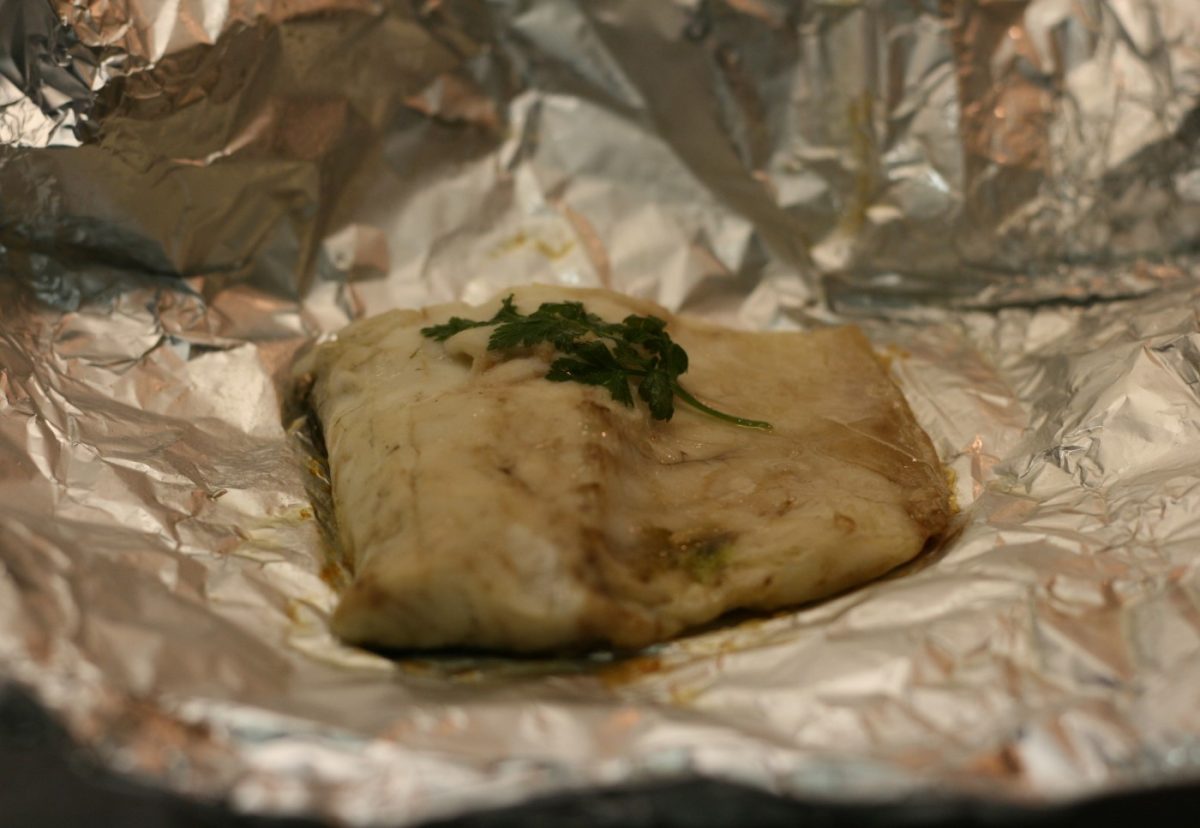 Lubina al horno con arroz de guisantes