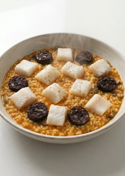 Arròs del paraigüer, arroz catalán de bacalao y butifarra negra