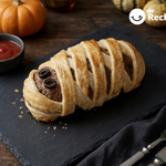 Pastel de carne momia para Halloween con hojaldre crujiente